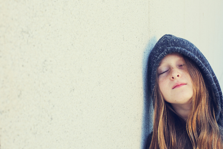 Portrait of 12 years old teenage girl outdoorの写真素材