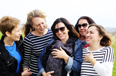 Group of mature beautiful ladies enjoying on a nice day outsideの写真素材