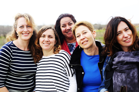 Group of mature beautiful ladies enjoying on a nice day outsideの写真素材