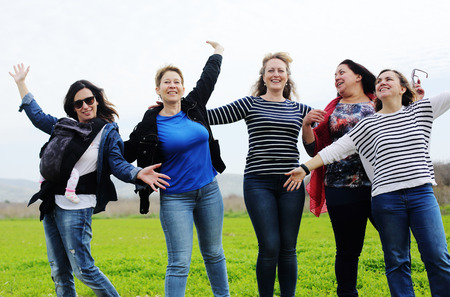 Group of mature beautiful ladies enjoying on a nice day outsideの写真素材