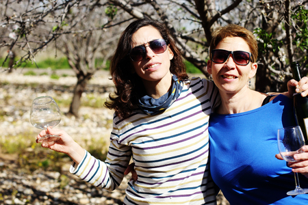 smiling real mature women celebrate birthday outdoorの写真素材