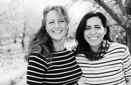 Portrait of two smiling real mature women outdoorの写真素材