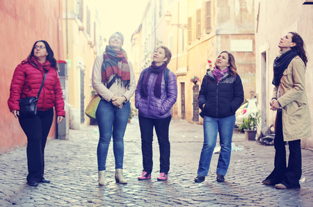 Women best friends smiling and walking at the cityの写真素材