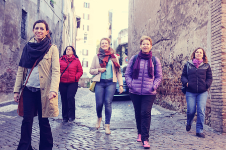 Women best friends smiling and walking at the city.の写真素材
