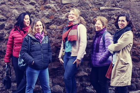 Women best friends smiling and walking at the cityの写真素材