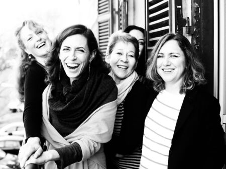 Women best friends smiling, drinking morning coffeeの写真素材