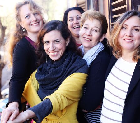 Women best friends smiling, drinking morning coffeeの写真素材
