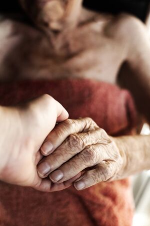 Close up of hands of aged woman. wrinkle skin.の写真素材