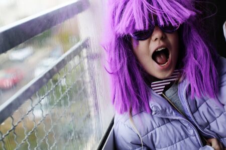 happy emotional child in carnival costume at homeの写真素材