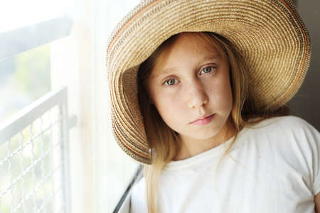 Portrait of serious child girl with frecklesの写真素材