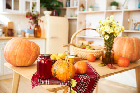 Vegan diet. Autumn harvest. Healthy, clean food and eating concept. Zero waste. Pumpkin soup with vegetarian cooking ingredients, wooden spoons, kitchen utensils on wooden background.の写真素材