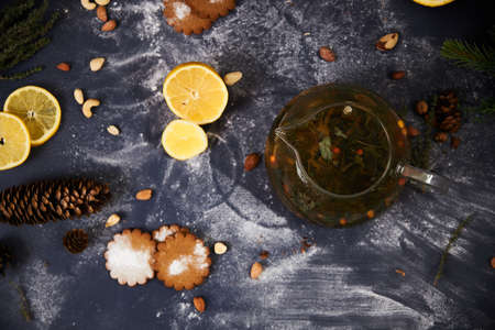 Glass teapot with lemons, Christmas decor with spruceの写真素材