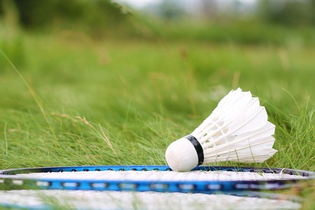 Shuttlecock and rackets for badminton on the green grass. Summer game for healthy lifestyle.の写真素材