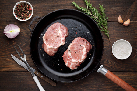 Two pieces of raw meat on a pan ready to roasting. Top view.の写真素材