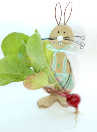 Poached eggs on toasted baguette slices.with a cucumber on a white plate.with a hare that holds a...