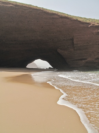 Coastal cliffs over a beach in Moroccoの写真素材