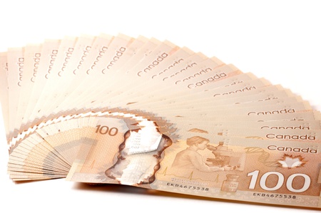 Canadian 100 dollar bills in polymer isolated on white backgroundの写真素材