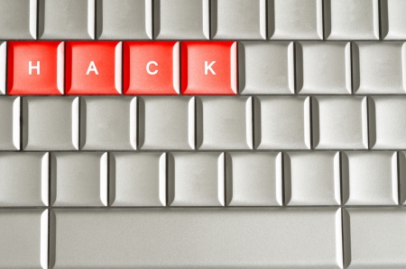 Hack word spelled on a metallic keyboardの写真素材