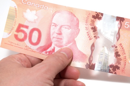 Hand holding 50 Canadian dollars
の写真素材