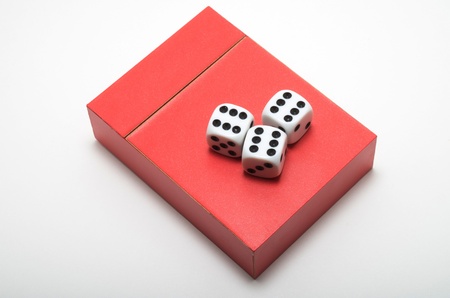 A packs of red cards and three dicesの写真素材