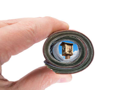 Concept freedom view through a roll of bank notesの写真素材