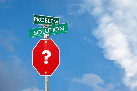 Problem and solution concept with signpost against blue sky backgroundの写真素材