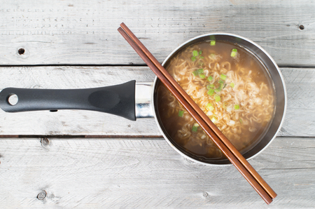 Asian instant noodle cooked in a saucepanの写真素材