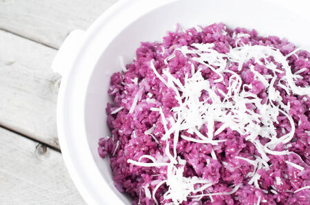 Vietnamese Magenta leaves sticky rice and slices of coconut - Xoi la camの写真素材