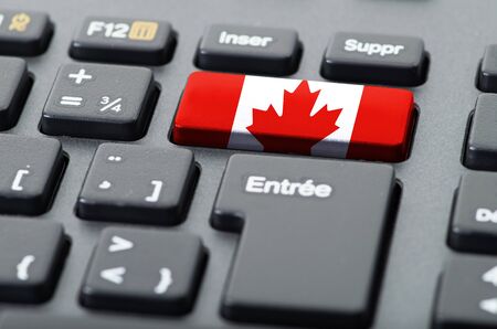 French keyboard with Canadian flag overlaidの写真素材