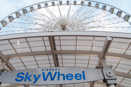 NIAGARA FALLS,CANADA-JULY16, 2012: Niagara SkyWheel is a 175-foot tall Ferris wheel in the middle of Clifton Hill, Niagara Falls, Ontario, Canada.のeditorial素材