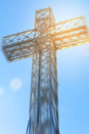 Giant metal cross background with blurred and flare effect applied
