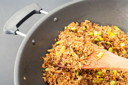 Chinese fried rice in a wok closeup studio shotの写真素材