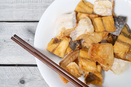 Vietnamese  deep fried dried Pangasius kunyit fish, ca dua kho chienの写真素材