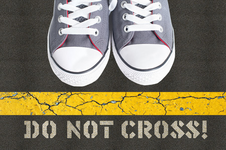 Do not cross concept with pair of gumshoesの写真素材