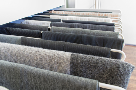 Men pants on a metal pull out rackの写真素材