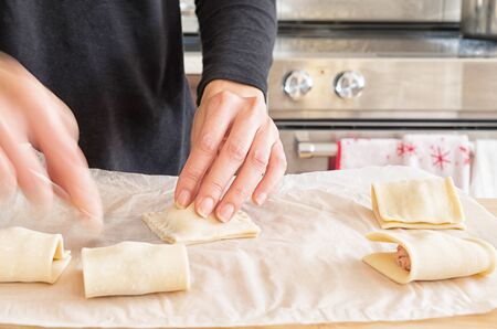 Woman preparing Vietnamese style Pate Chaud in a kitchenの写真素材