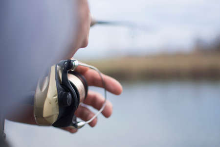 A man enjoys in the free time he spends himself on fishingの写真素材