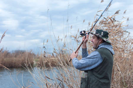 A man enjoys in the free time he spends himself on fishing