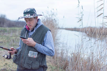 A man enjoys in the free time he spends himself on fishingの写真素材