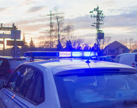 serbian police car parked with rotary lightsの写真素材