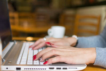 hands typing keyboard laptop computerの写真素材