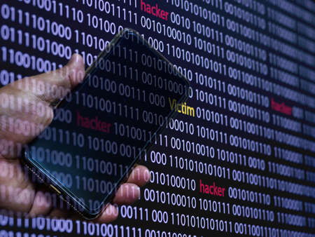 Computer screen shot with binary code and smartphone, great concept for technology computer and...