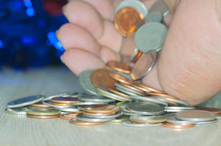 Saving money concept preset by Male hand putting coin growing businessの写真素材