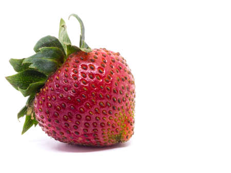 Closeup shot of fresh strawberries. Isolated on white background.の写真素材