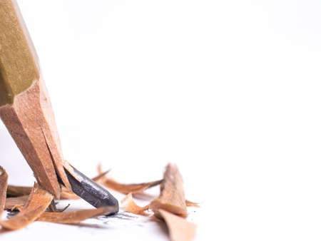 Closeup pencil with a broken tip on white  backgroundの写真素材