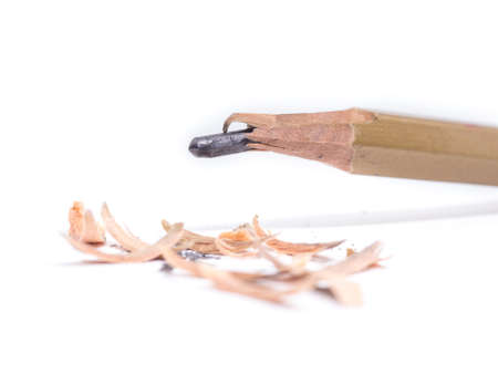 Closeup pencil with a broken tip on white  backgroundの写真素材