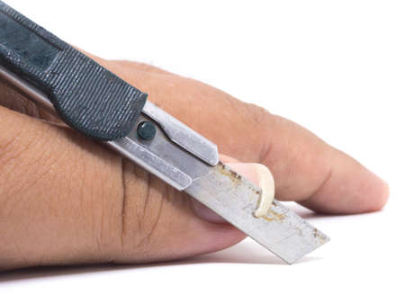 Closeup of a man cutting nails by rusty cutterの写真素材
