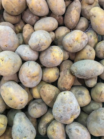 Potatoes on market. Vegetables background.の写真素材
