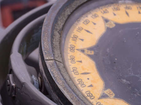 Vintage Big Compass on the Battleship for navigate in the seaの写真素材