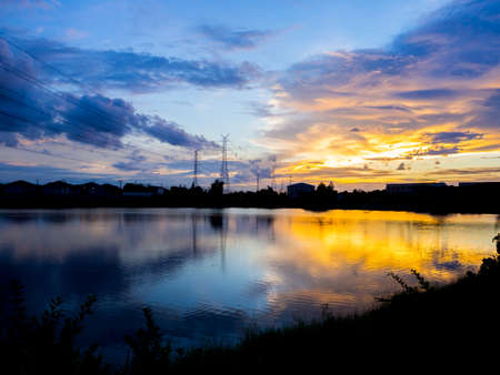 Golden cloud and river on twilight timesの写真素材